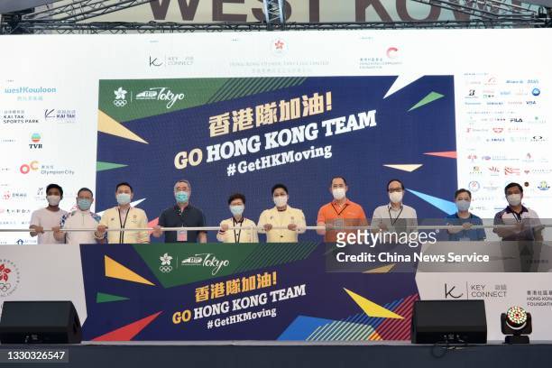 Hong Kong Chief Executive Carrie Lam Cheng Yuet-ngor and Kenneth Fok Kai-kong , chairman of the Hong Kong Olympic Fans Club and vice-president of the...