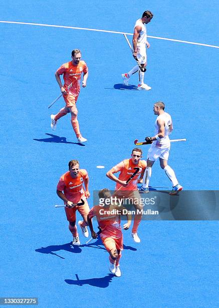 Jeroen Hertzberger of Team Netherlands celebrates scoring a goal with teammates against Team Belgium during the Men's Pool B match on day one of the...
