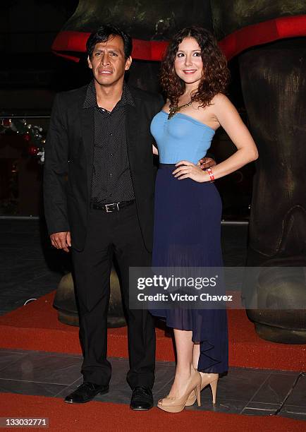 Actor Gerardo Taracena and guest walk the red carpet for the "Puss in Boots " Mexico City premiere at the Cinemex Antara Polanco on November 15, 2011...