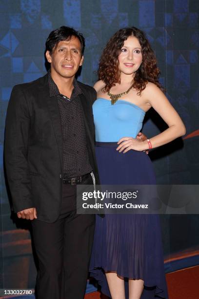 Actor Gerardo Taracena and guest walk the red carpet for the "Puss in Boots " Mexico City premiere at the Cinemex Antara Polanco on November 15, 2011...