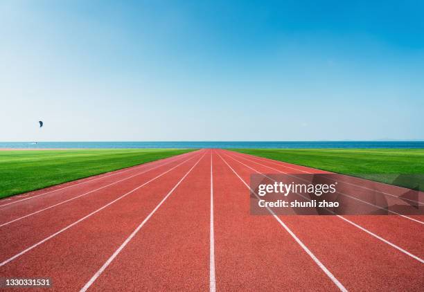 athletics track by the sea - 陸上競技場　無人 ストックフォトと画像