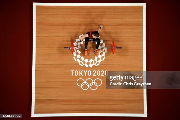 Hiromi Miyake of Team Japan competes during the Weightlifting - Women's 49kg Group A on day one of the Tokyo 2020 Olympic Games at Tokyo...