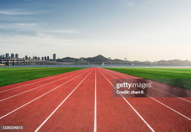 athletics track in an urban seaside park - athletics arena stock pictures, royalty-free photos & images