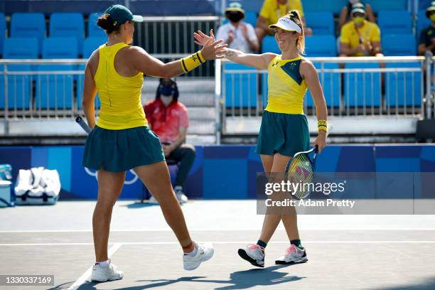 Ashleigh Barty of Team Australia celebrates victory with partner Storm Sanders of Team Australia after their Women's Doubles First Round match...