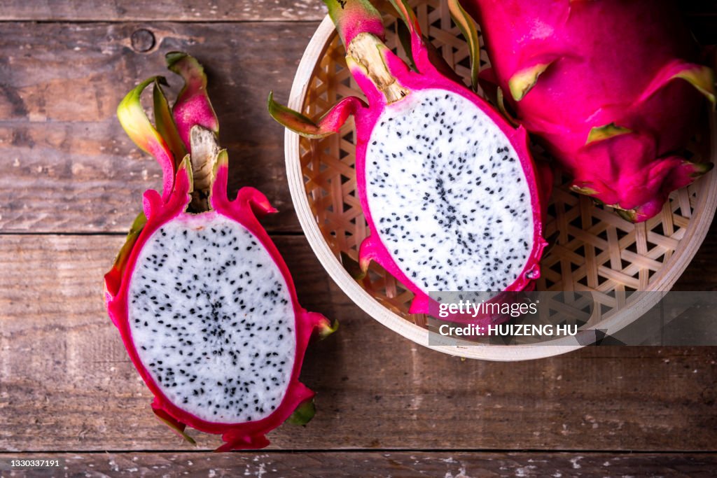 Healthy dragon fruits on wooden background