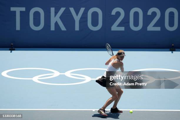 Mona Barthel of Team Germany plays a backhand during her Women's Singles First Round match against Iga Swiatek of Team Poland on day one of the Tokyo...