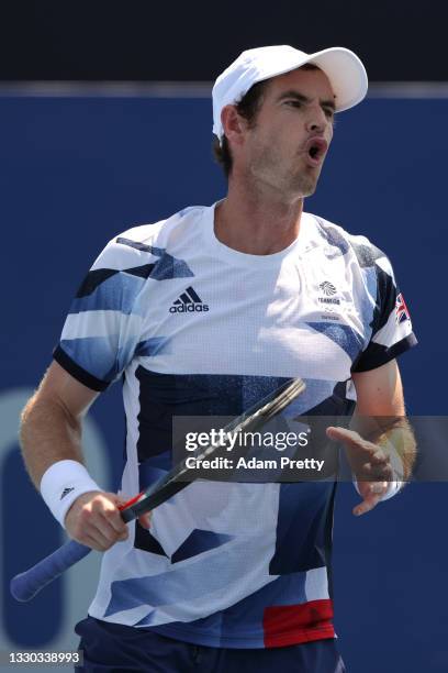 Andy Murray of Team Great Britain reacts after a point during his Men's Doubles First Round match with Joe Salisbury of Team Great Britain against...