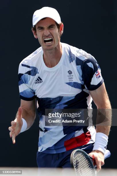 Andy Murray of Team Great Britain reacts after a point during his Men's Doubles First Round match with Joe Salisbury of Team Great Britain against...