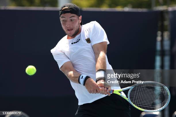 Jan-Lennard Struff of Team Germany plays a backhand during his Men's Singles First Round match against Thiago Monteiro of Team Brazil on day one of...