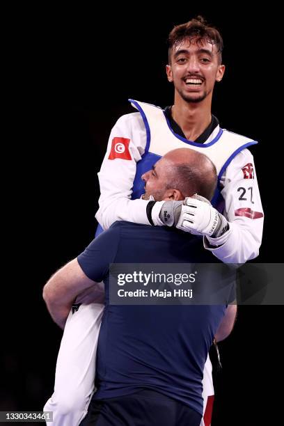 Mohamed Khalil Jendoubi of Team Tunisia celebrates after defeating Jang Jun of Team South Korea during the Men's -58kg Taekwondo Semifinal contest on...