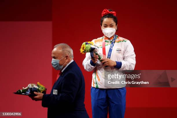 Silver medalist Chanu Saikhom Mirabai of Team India poses with the Silver medal for the Weightlifting - Women's 49kg Group A on day one of the Tokyo...