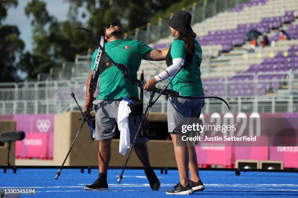 Luis Alvarez and Alejandra Valencia of Team Mexico react after winning the bronze medal for the Mixed Team competition on day one of the Tokyo 2020...