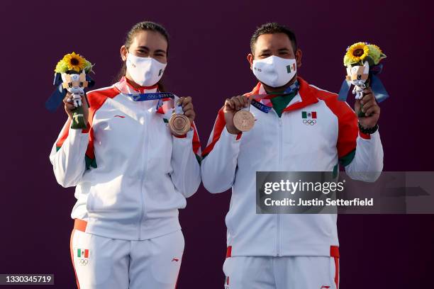 Alejandra Valencia and Luis Alvarez of Team Mexico pose with their bronze medals for the Mixed Team competition on day one of the Tokyo 2020 Olympic...