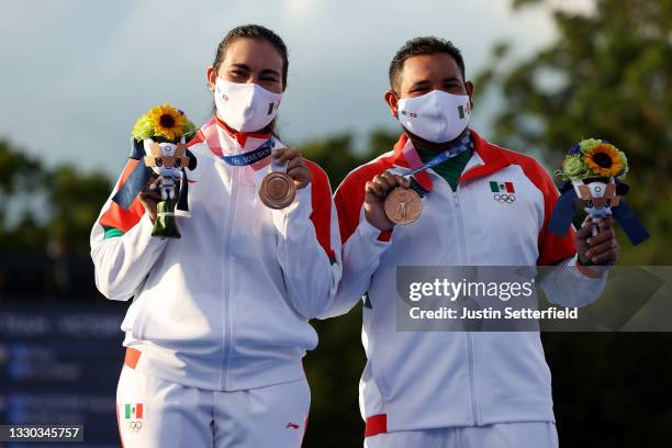 Alejandra Valencia and Luis Alvarez of Team Mexico pose with their bronze medals for the Mixed Team competition on day one of the Tokyo 2020 Olympic...