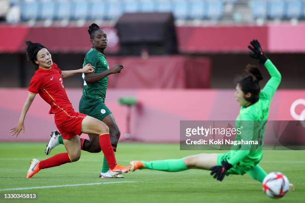 Babra Banda of Team Zambia scores their side's third goal past Shimeng Peng of Team China during the Women's First Round Group F match between China...