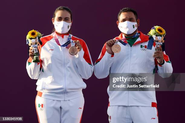 Alejandra Valencia and Luis Alvarez of Team Mexico pose with their bronze medals for the Mixed Team competition on day one of the Tokyo 2020 Olympic...