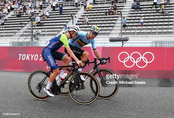 Tadej Pogacar of Team Slovenia bronze medal & Wout van Aert of Team Belgium silver medalist celebrate on arrival during the Men's road race at the...