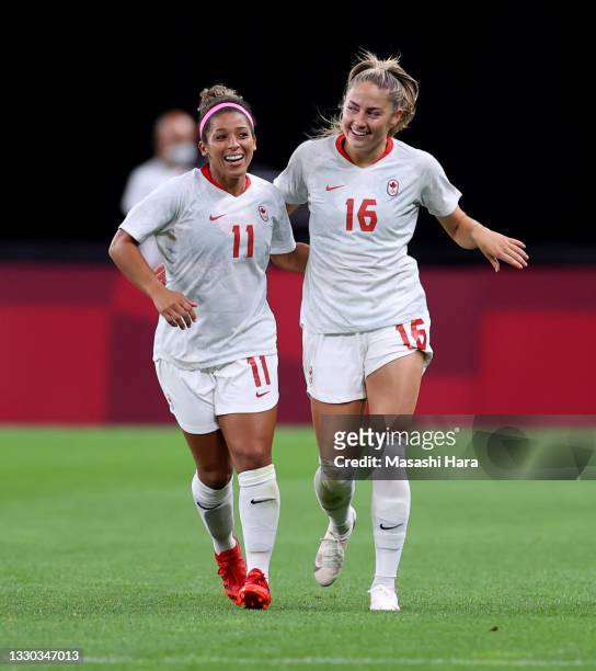 Janine Beckie of Team Canada celebrates with teammate Desiree Scott after scoring their side's second goal during the Women's First Round Group E...