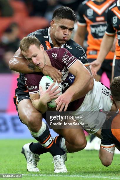 Daly Cherry-Evans of the Sea Eagles scores a try during the round 19 NRL match between the Manly Sea Eagles and the Wests Tigers at Suncorp Stadium,...