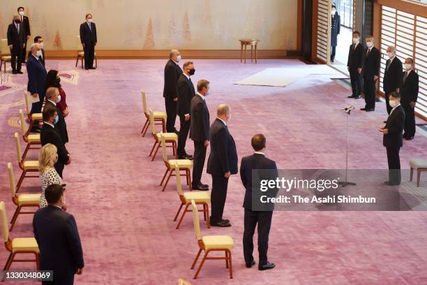 Emperor Naruhito speaks to heads of states during their meeting at the Imperial Palace ahead of the opening ceremony of the Tokyo Olympic Games on...