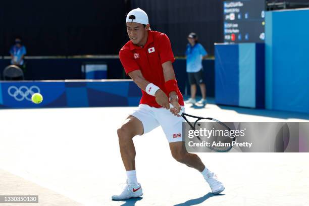 Kei Nishikori of Team Japan plays a backhand during his Men's Doubles First Round match with Ben McLachlan of Team Japan on day one of the Tokyo 2020...