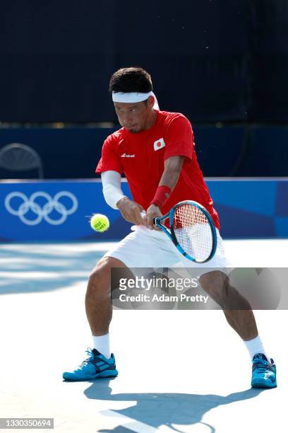 Yuichi Sugita of Team Japan plays a backhand during his Men's Singles First Round match against Fabio Fognini of Team Italy on day one of the Tokyo...