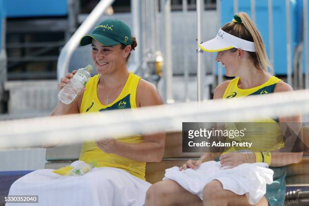Ashleigh Barty of Team Australia talks with partner Storm Sanders of Team Australia after their Women's Doubles First Round match against Nao Hibino...