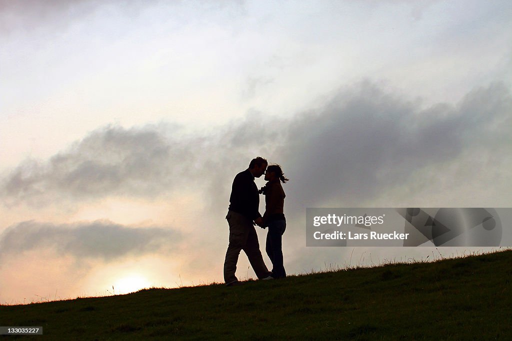 Romantic silhouette couple hugging