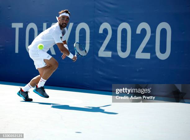 Fabio Fognini of Team Italy plays a backhand during his Men's Singles First Round match against Yuichi Sugita of Team Japan on day one of the Tokyo...