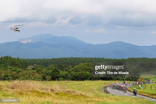 General view of the peloton starting the ascent to Fuji Sanroku Suyama during the Men's road race at the Fuji International Speedway on day one of...