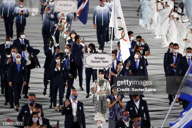 Refugee Olympic Team walk in the parade during the Opening Ceremony of the Tokyo 2020 Olympic Games at Olympic Stadium on July 23, 2021 in Tokyo,...