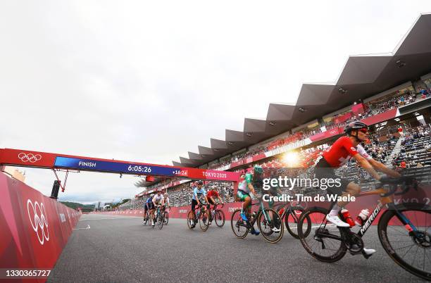 Nicolas Roche of Team Ireland, Edward Dunbar of Team Ireland & Gino Maeder of Team Switzerland on arrival during the Men's road race at the Fuji...