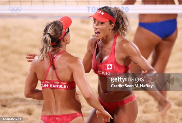 Heather Bansley and Brandie Wilkerson of Team Canada react against Team China during the Women's Preliminary - Pool C on day one of the Tokyo 2020...