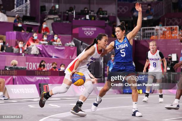 Tserenlkham Munkhsaikhan of Team Mongolia is challenged by Kelsey Plum of Team United States during the Women's Pool Round match between Mongolia and...