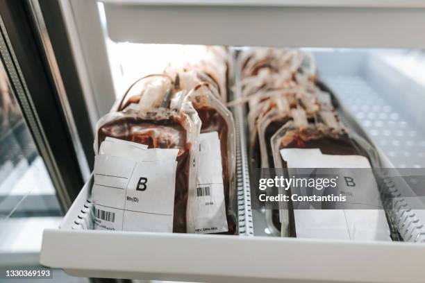 blood supplies at the transfusion facility - blood bag imagens e fotografias de stock