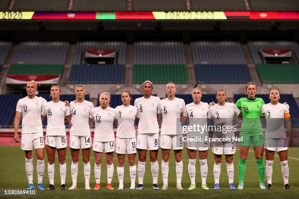 Players of Team New Zealand stand for the national anthem prior to the Women's First Round Group G match between New Zealand and United States on day...