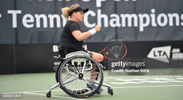 Aniek van Koot of Netherlands reacts as she wins a point with Diede de Groot as they compete in the women's doubles final match against Lucy Shuker...