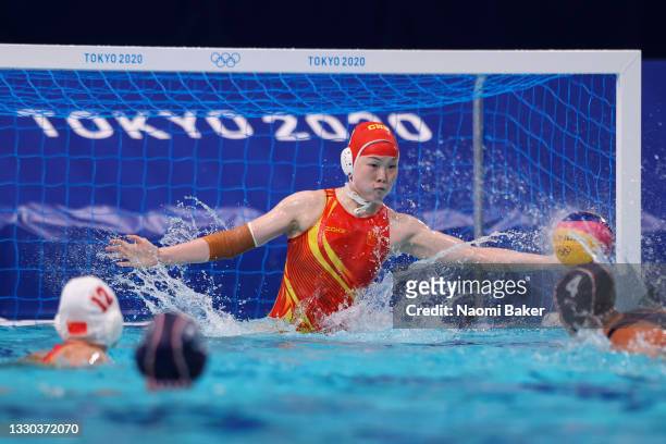 Lin Peng of Team China saves a penalty from Elvina Karimova of Team ROC during the Women's Preliminary Round Group B match between China and ROC on...