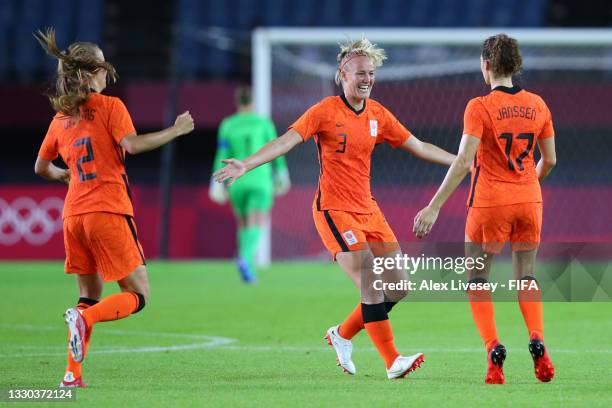 Dominique Janssen of Team Netherlands celebrates with Stefanie van der Gragt after scoring their side's third goal during the Women's First Round...