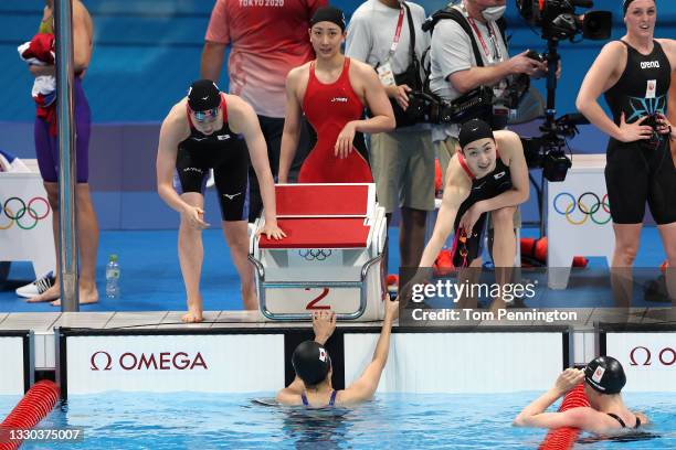 Chihiro Igarashi, Rikako Ikee, Natsumi Sakai and Rika Omoto of Team Japan celebrate after coming fifth in heat two of the Women's 4 x 100m Freestyle...