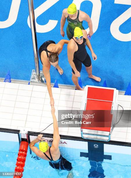 Mollie O'Callaghan, Meg Harris, Madison Wilson and Bronte Campbell of Team Australia celebrate after coming first in heat two of the Women's 4 x 100m...