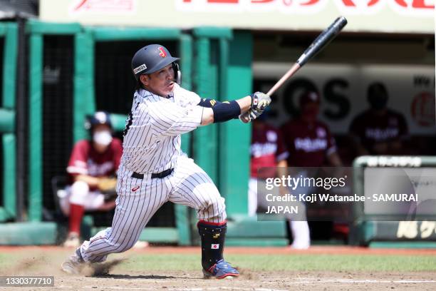 Takuya Kai of Samurai Japan hits a single during in the bottom half of the sinth inning the practice game between Samurai Japan and Tohoku Rakuten...