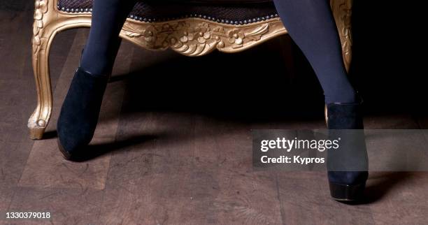 young woman wearing high heeled shoes - women in stockings and high heels stock pictures, royalty-free photos & images