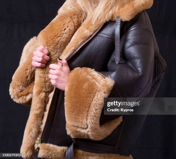 sheepskin coat - studio shot - sheepskin stock pictures, royalty-free photos & images