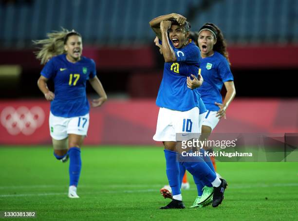 Marta of Team Brazil celebrates after scoring their side's second goal during the Women's First Round Group F match between Netherlands and Brazil on...