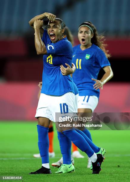 Marta of Team Brazil celebrates after scoring their side's second goal during the Women's First Round Group F match between Netherlands and Brazil on...