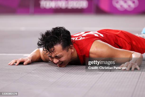 Tomoya Ochiai of Team Japan is fouled during the Men's Pool Round match between Belgium and Japan on day one of the Tokyo 2020 Olympic Games at Aomi...