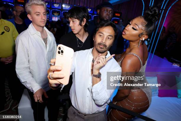 Yu Tsai and Megan Thee Stallion attend the Sports Illustrated Swimsuit celebration of the launch of the 2021 Issue at Seminole Hard Rock Hotel &...