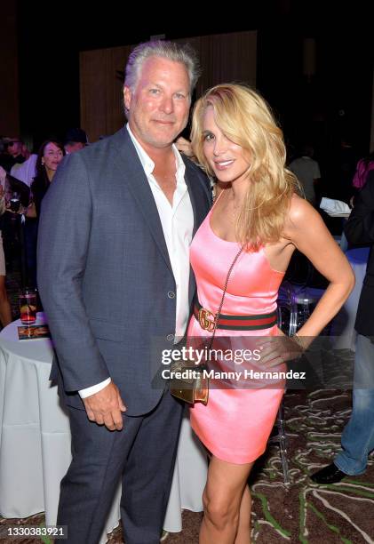 Ross Levinsohn and Alison Brod visit the Popeyes Nuggets activation at the Sports Illustrated Swimsuit Party on July 23, 2021 in Hollywood, Florida.
