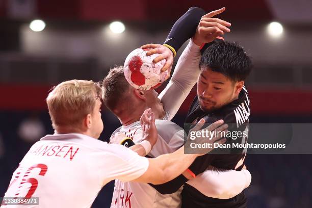 Kotaro Mizumachi of Team Japan being challenged by m_den2 during the Men's Preliminary Round Group B match between Denmark and Japan on day one of...